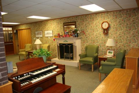 Comfy "den" with fireplace, organ and chairs