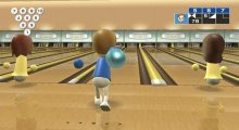 Wii avatar on a bowling alley with a ball in their hand